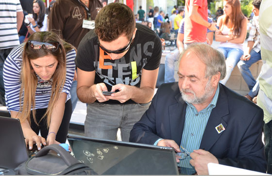 Encouraged by Dr Nabil Haddad (right) Notre Dame University–Louaize students vote in the New7Wonders of Nature