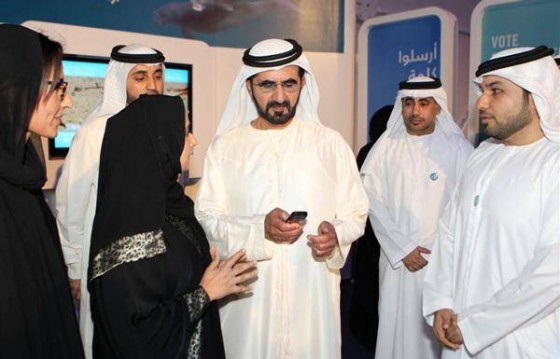 His Highness Sheikh Mohammad Bin Rashid Al Maktoum (centre) voting during his visit to the Bu Tinah Experience on the Abu Dhabi Corniche.