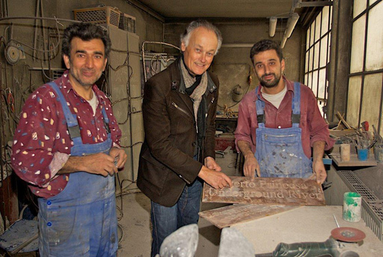 Bernard Weber, Founder-President of New7Wonders (centre), with Hasan Göktepe (left) and Aslan Göktepe (right) of the Kunstgießerei München inspecting the Puerto Princesa Underground River plaque.