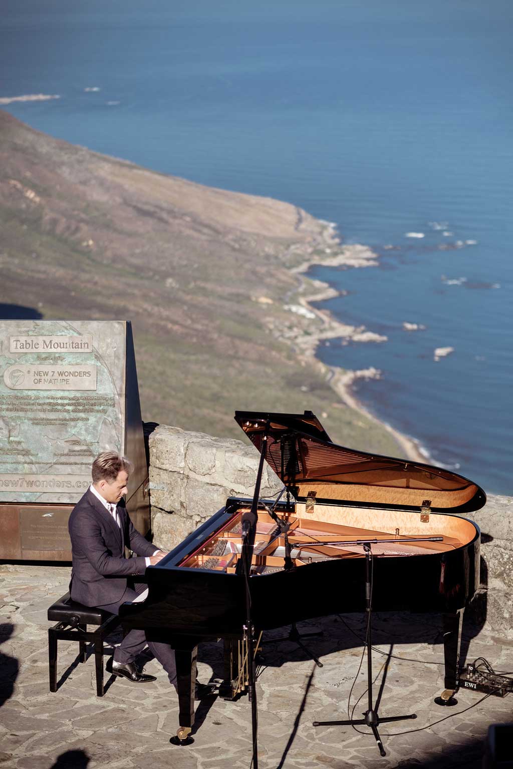 With the New7Wonder of Nature commemorative plaque in the background, Charl du Plessis serenades Table Mountain